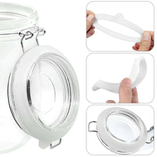 White silicone sealing gasket ring for mason jar lid, shown around jar rim