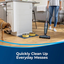 Upright vacuum cleaning hardwood floor with motorized brush head, BISSELL Featherweight