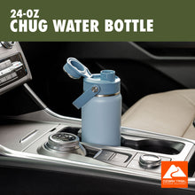 Light blue chug water bottle with flip lid and carry handle on car console