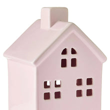 Pink ceramic house decoration with side angle and cutout door and windows