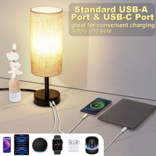 Touch table lamp with linen drum shade, black base, and USB charging ports