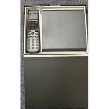 Streaming media player box with black remote and media player tray