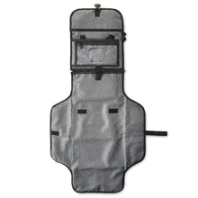 Gray portable changing pad with fold-out cover and front accessory pocket