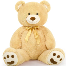 Tan teddy bear plush with gold ribbon bow and bear-face paw pads