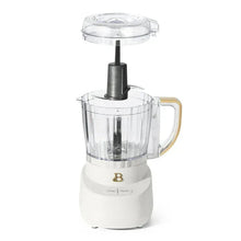 White 3-cup food chopper with clear lid and center blade post, standing unit