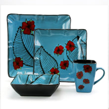 Blue stoneware dinnerware set with red flower and leaf design, square plates, bowl, mug