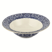 Navy and white patterned ceramic serve bowl with white interior