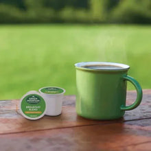 Green Mountain Breakfast Blend K-Cup pod container and green mug with coffee