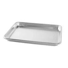 Rectangular natural aluminum baking sheet pan with shallow lip and smooth surface
