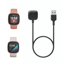 Charging cable with USB-A plug and black charging puck, shown with two smartwatches.