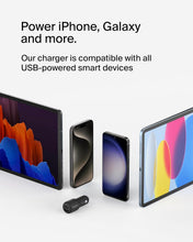 Gray Belkin BoostCharge car charger near smartphones on a charging scene
