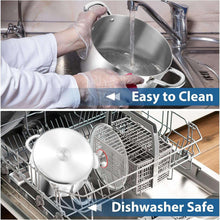 Stainless steel stock pot with glass lid and side handles during water rinse