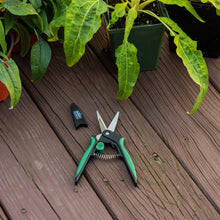 Green and black garden snips with protective sheath, pointed blades, and squeeze handle