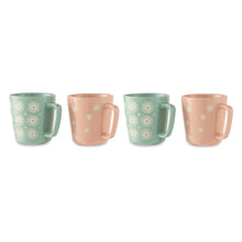 Four ceramic coffee mugs in mint green and blush pink with white starburst design
