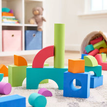 Stack of colorful foam building blocks in playroom, arched and square shapes