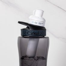 Gray plastic water bottle with black lid and visible Berry Blue Punch flavor cartridge