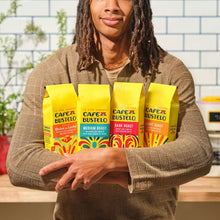 Four ground coffee bags held together, yellow Cafe Bustelo branding visible