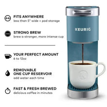 Keurig single-serve coffee maker in evening teal with cup and pod area