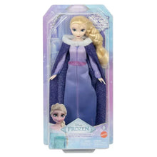 Elsa fashion doll in clear blister packaging, wearing a purple cape dress