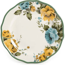 Floral dinner plate with green rim, yellow roses and light blue flowers