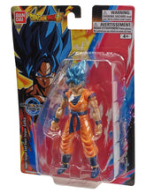 Boxed action figure blister pack, orange gi and cyan spiky hair with warning text
