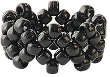 Pile of black plastic pony beads with center holes