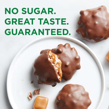 Chocolate-coated pecan caramel candy pieces on a plate