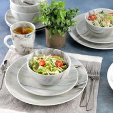 Porcelain dinnerware set with plate and bowl in blue marble-style pattern