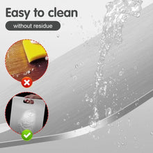 Brushed titanium cutting board with water spray, emphasizing easy residue-free cleaning