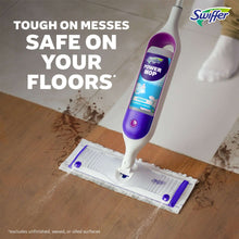 Power mop with purple reservoir and striped pad on wood floor