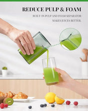 Centrifugal juicer with feed chute pouring juice into glasses, showing pulp separator area.