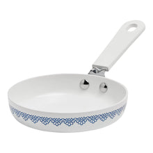 Agatha Blue ceramic skillet with blue floral rim, white interior, and stainless side handle