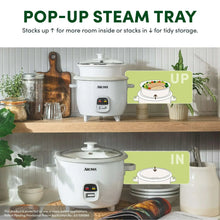 White rice cooker with pop-up steam tray shown for steaming