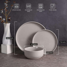 Gray stoneware plates and small bowls, stacked dinnerware