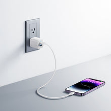 White Anker 33W dual USB wall charger plugged into an AC outlet