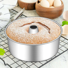 Stainless steel tube cake pan filled with batter and center tube