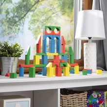Colorful wooden blocks arranged into a house-like shape on a tabletop.