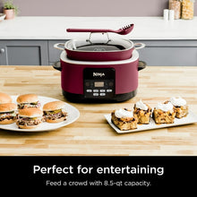 Cherry tarte Ninja multi-cooker with glass lid and red utensil on top