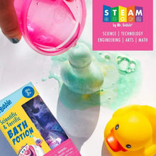 Bath potion bottle and box near pink and green foam, plus yellow rubber duck.
