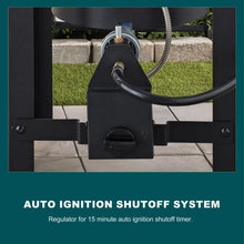 Black auto ignition shutoff box with connected hose on turkey fryer stand