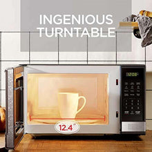 Microwave oven door open with cup on turntable, 12.4 in cavity