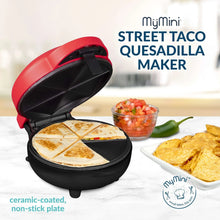 Red and black street taco quesadilla maker open with golden quesadilla and toppings