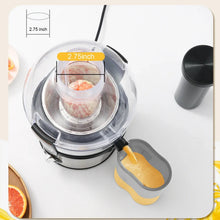 Juicer machine with clear 2.75 in feed chute and pusher, top-down view
