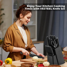 Chef knife set with black knife block and stainless knives on a kitchen counter