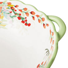 Ceramic serving bowl with mint green rim, side handle, and multicolor floral painting