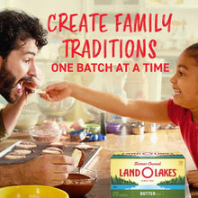 Land O Lakes salted butter box on a kitchen table near baked cookies