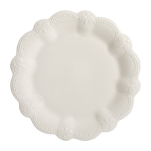 White scalloped dinner plate with dotted bead trim and embossed center