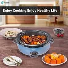 Blue slow cooker pot filled with stew and vegetables, black control dial
