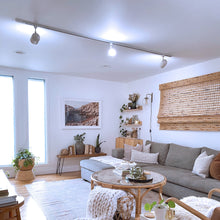 Smart LED bulbs illuminating a living room ceiling