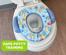 Bluey potty training seat on toilet bowl, gray insert and blue side handles